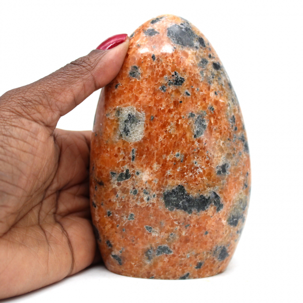 Polierter orangefarbener calcit-stein