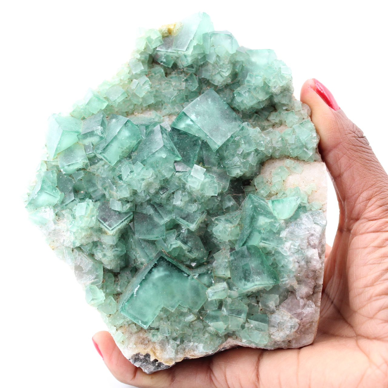 Kubische Kristalle aus grünem Fluorit auf massivem Fluorit