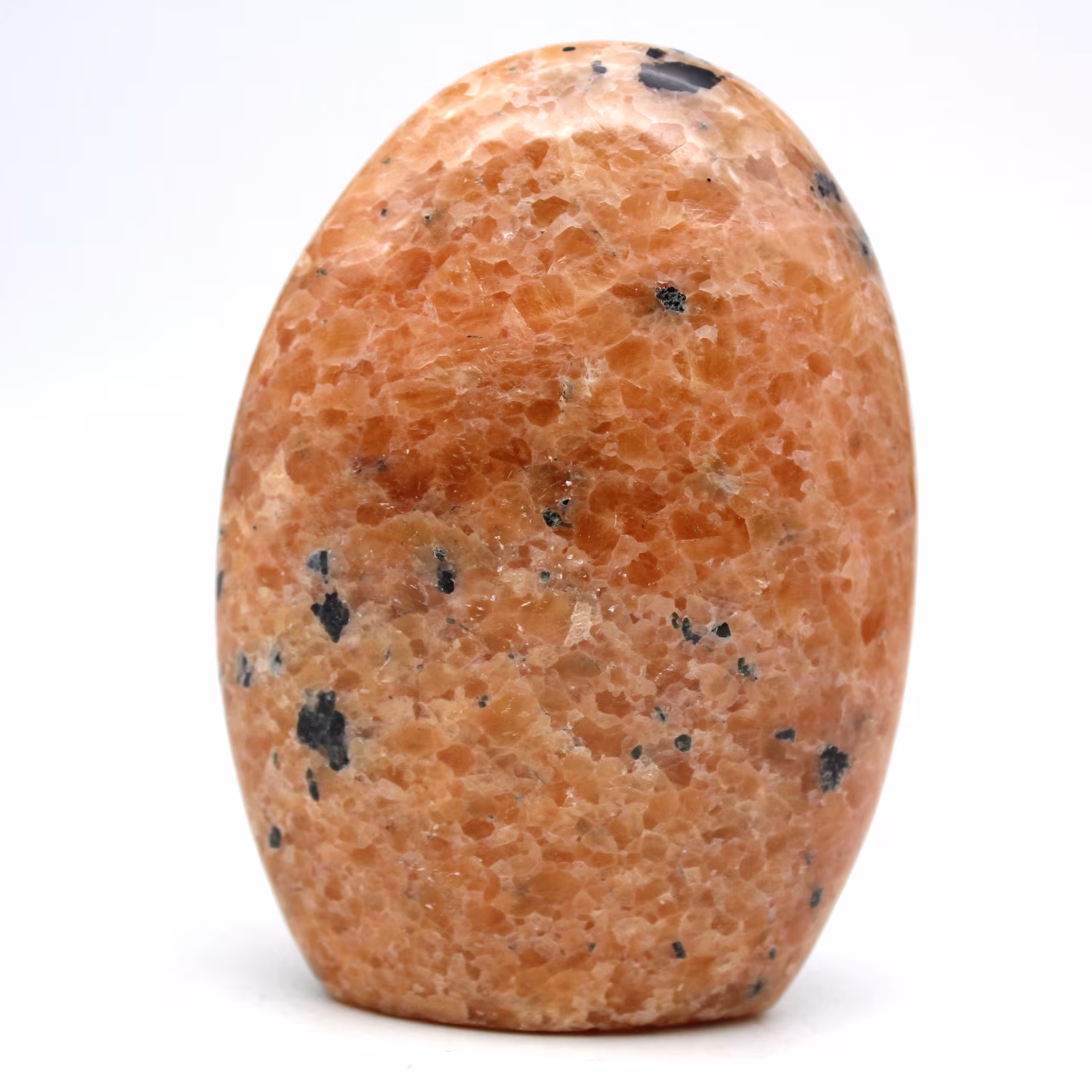 Polierter stein aus orangefarbenem calcit