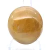 Kleiner gelber madagassischer Quarz-Trommelstein zur Ausstellung - 1
